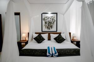 Letto o letti in una camera di Namika Villas Ubud