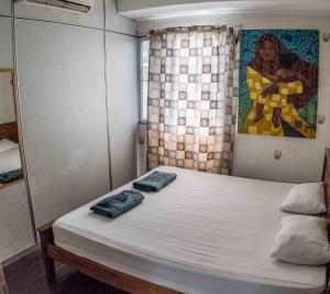 Postel nebo postele na pokoji v ubytování Discovery Youth Hostel Malacca