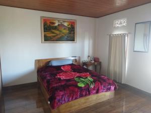 Кровать или кровати в номере Highland Santi Homestay