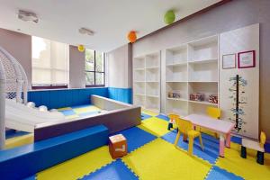a childs room with a lego play room at Modena by Fraser Zhuankou Wuhan in Wuhan
