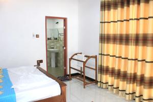 Letto o letti in una camera di Sigiri Sanu Villa