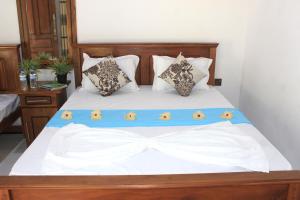 Letto o letti in una camera di Sigiri Sanu Villa