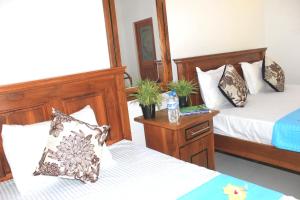 Letto o letti in una camera di Sigiri Sanu Villa