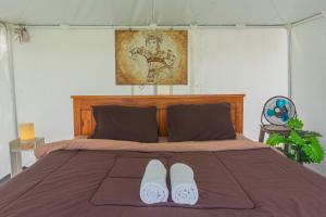 Postel nebo postele na pokoji v ubytování Polestay Glamping Kintamani
