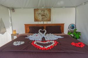 Postel nebo postele na pokoji v ubytování Polestay Glamping Kintamani