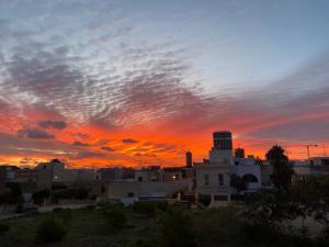 a view of a city at sunset at Pembroke Suites in Pembroke 