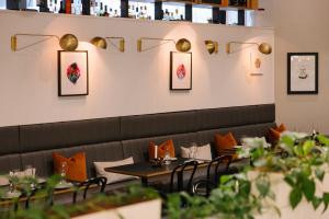 a dining room with a table and chairs at Song Hotel Sydney in Sydney