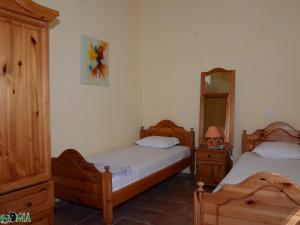a bedroom with two beds and a mirror at Villa Puma in Balchik +47 photos