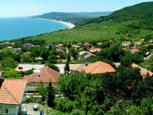 a view of a town with a beach and water at Villa Puma in Balchik
