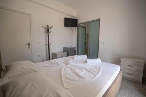 Postel nebo postele na pokoji v ubytování Sunset Aparthotel