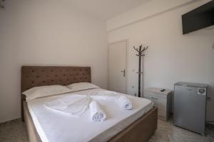 Postel nebo postele na pokoji v ubytování Sunset Aparthotel