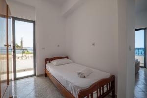 Postel nebo postele na pokoji v ubytování Sunset Aparthotel