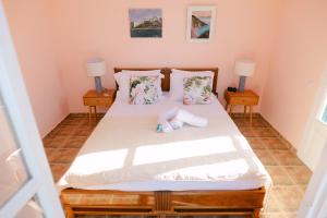 Postel nebo postele na pokoji v ubytování Villa Il Paradiso Andros