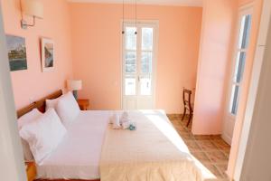 Postel nebo postele na pokoji v ubytování Villa Il Paradiso Andros