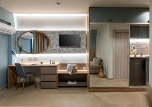 an office with a desk and a sink and a mirror at Nerium Apartments Leptokaria in Leptokarya