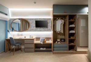 a dressing room with a desk and a mirror at Nerium Apartments Leptokaria in Leptokarya