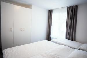 Postel nebo postele na pokoji v ubytování Apartmány Banff