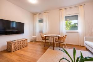 TV a/nebo společenská místnost v ubytování Kis Residence - Adults Only