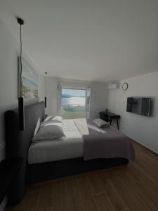 En eller flere senge i et værelse på Villa Panorama + 51 billeder