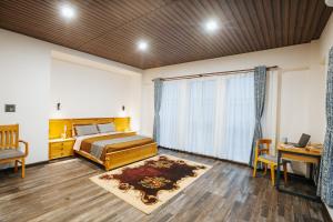 Vuode tai vuoteita majoituspaikassa Anandalaya by Dosro Home 19 kuvaa lisää