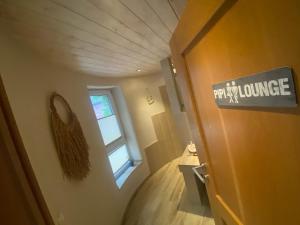 a bathroom with a sign on the door of a house at Turm auf altem Bauernhof in Götterswickerhamm