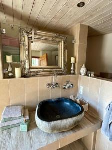 a large tub in a bathroom with a mirror at Turm auf altem Bauernhof in Götterswickerhamm