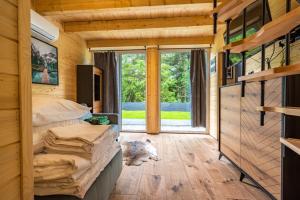 a room with a bed and a large window at Rykowisko Korbielów 2 in Korbielów