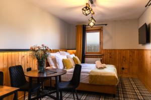 En eller flere senge i et værelse på Zapotoczny Residence