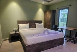 Postel nebo postele na pokoji v ubytování Hotel Peppers