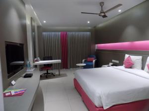 Postel nebo postele na pokoji v ubytování ZIBE Coimbatore by GRT Hotels