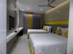 Postel nebo postele na pokoji v ubytování ZIBE Coimbatore by GRT Hotels