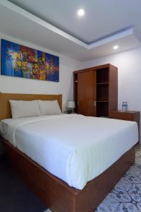 Postel nebo postele na pokoji v ubytování Attara Inn Senggigi
