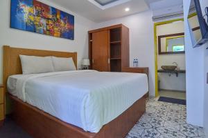 Postel nebo postele na pokoji v ubytování Attara Inn Senggigi