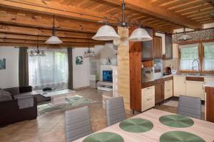a kitchen and living room with a table and chairs at Apartment in Balatonbereny - Balaton 18043 in Balatonberény