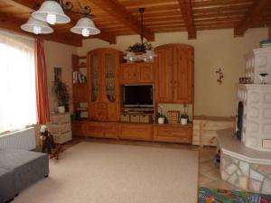 a living room with wooden cabinets and a television at Apartment in Balatonbereny - Balaton 18043 in Balatonberény