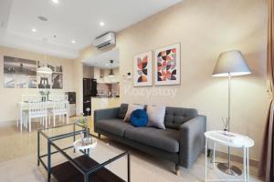 a living room with a couch and a table at Serei by Kozystay - BSD in Tangerang