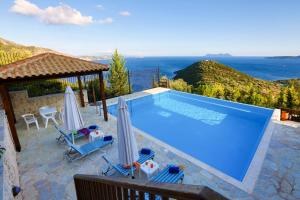 a swimming pool with a view of the ocean at Villa Columba - Luxury Private Villa in Modern Residence in Sivota