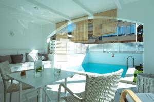 a balcony with a table and chairs and a building at 272 Casa Sol ETV7727 by Mallorca Charme in Can Picafort
