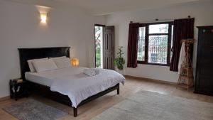 Letto o letti in una camera di Nextdoor Kathmandu