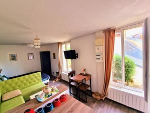Posezení v ubytování Le Paradis - Charmants appartements proche nature
