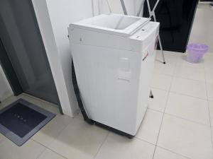 a white refrigerator with a sink on top of it at Homestay A&A in Sungai Petani +9 photos