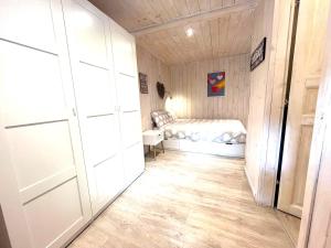 a small room with a bed and a closet at Due cuori e... un Loft nel cuore antico di Aosta in Aosta