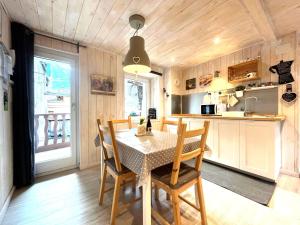 a kitchen and dining room with a table and chairs at Due cuori e... un Loft nel cuore antico di Aosta in Aosta