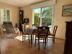 a dining room with a table and chairs at Maison au calme avec jardin in Brouzet-lès-Alès