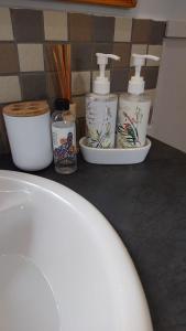a counter with three bottles ofodorizers on a counter at Oaktree in Burgersdorp +7 photos