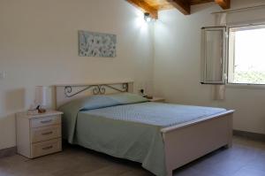 Postel nebo postele na pokoji v ubytování Antica Dimora Arancio Val Di Noto 10 minuti dal mare Free Parking