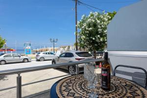 a table with a car parked on a balcony at Chara Sea View Luxury House in Limenas