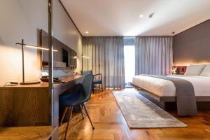 Postel nebo postele na pokoji v ubytování Ramada Encore by Wyndham Makati + 37 fotografií