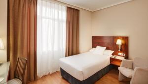 Postel nebo postele na pokoji v ubytování Sercotel Los Llanos