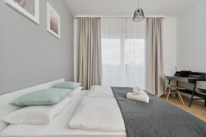 Posteľ alebo postele v izbe v ubytovaní Modern Studio Słonimskiego with Balcony by Noclegi Renters